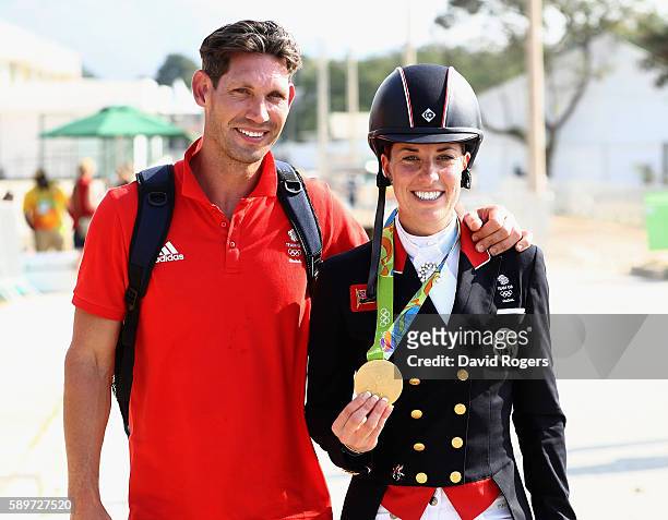 Charlotte Dujardin of Great Britain walks with her fiance, Dean Wyatt Golding after winning the gold medal during the Dressage Individual Grand Prix...