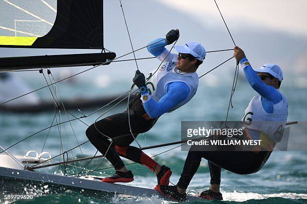 Argentina's Yago Lange and Klaus Lange compete in the 49ers men's opening series at Marina da Gloria during the Rio 2016 Olympic Games in Rio de...