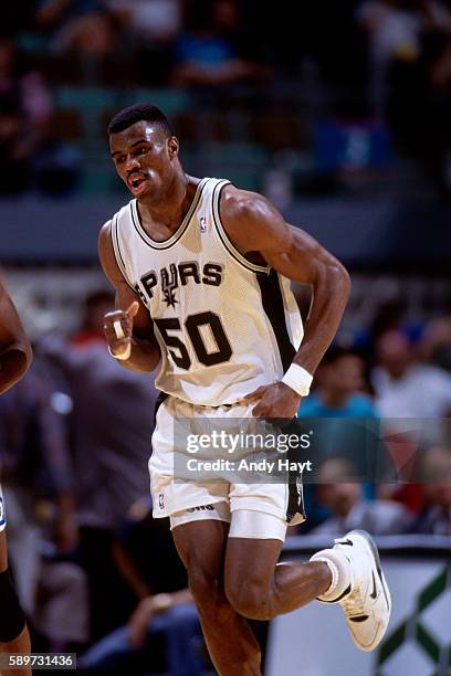 David Robinson of the San Antonio Spurs runs the floor during a game circa 1993 at the Alamodome in San Antonio, Texas. NOTE TO USER: User expressly...