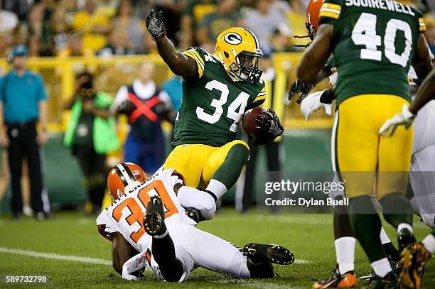 Terrell Watson of the Cleveland Browns tackles Brandon Burks of the Green Bay Packers in the third quarter at Lambeau Field on August 12, 2016 in...