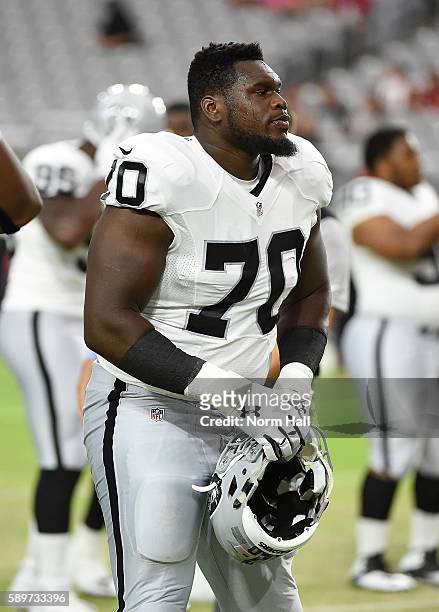 Kelechi Osemele of the Oakland Raiders warms up prior to a game against the Arizona Cardinals at University of Phoenix Stadium on August 12, 2016 in...