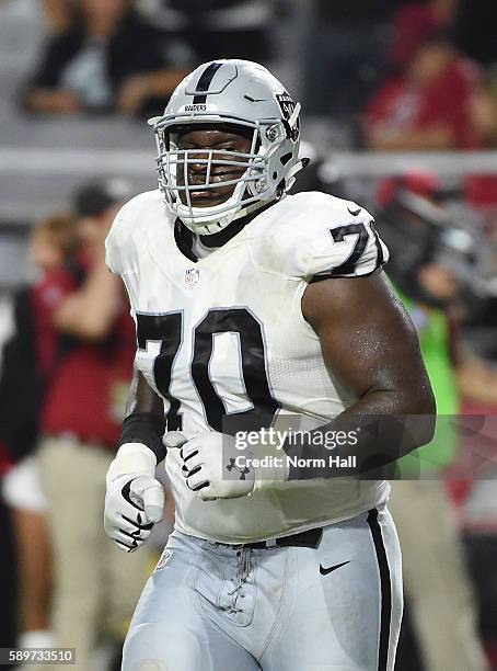 Kelechi Osemele of the Oakland Raiders runs back to the huddle after the end of a play against the Arizona Cardinals at University of Phoenix Stadium...