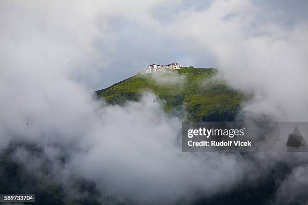 schmittenhöhe summit in clouds from zell am see - zell am see stock pictures, royalty-free photos & images