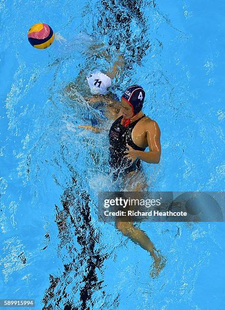 Mariana Duarte of Brazil holds off Rachel Fattal of USA in the Brazil v USA Women's water Polo Quarter Final at Olympic Aquatics Stadium on August...