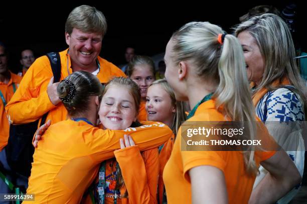 King Willem-Alexander and Queen Maxima congratulate Netherlands' Sanne Wevers on winning the women's balance beam event final of the Artistic...