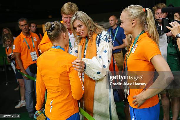 Gold medalist Sanne Wevers of the Netherlands is congratulated by Queen Maxima of the Netherlands while King Willem-Alexander and their daughters...