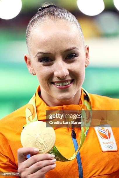 Gold medalist Sanne Wevers of the Netherlands poses for photographs after the at the medal ceremony for the Balance Beam on day 10 of the Rio 2016...