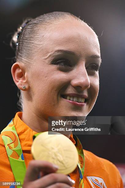 Gold medalist Sanne Wevers of the Netherlands poses for photographs after the at the medal ceremony for the Balance Beam on day 10 of the Rio 2016...