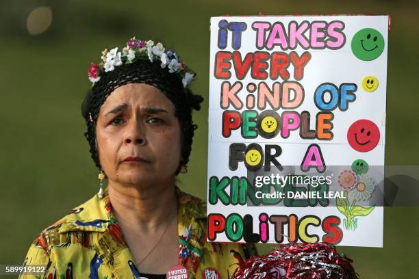 Supporter of Jeremy Corbyn holds up a placard at a Black, Asian and minority ethnic rally in north London on August 15, 2016 organised by 'Jeremy for...