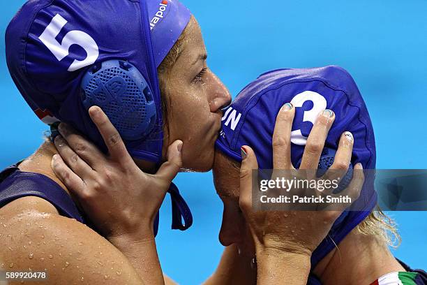 Gabriella Szucs kisses teammate Dora Antal of Hungary before an overtime shootout against Australia on Day 10 of the 2016 Rio Olympics at Olympic...