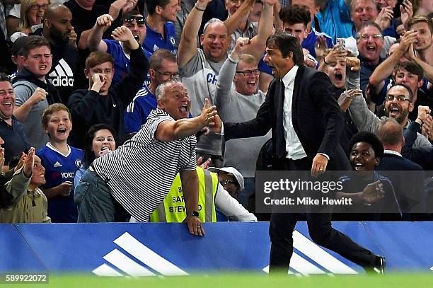 Antonio Conte, Manager of Chelsea celebrates the goal scored by Diego Costa of Chelsea during the Premier League match between Chelsea and West Ham...