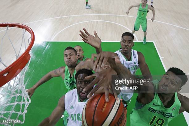 Nigeria's power forward Ike Diogu and Brazil's shooting guard Leandro Barbosa go for a rebound during a Men's round Group B basketball match between...