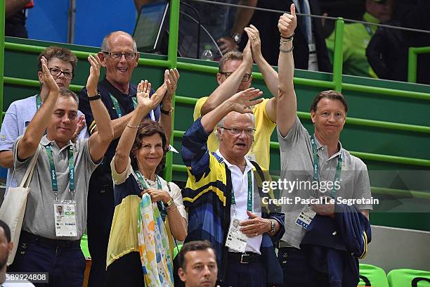 Queen Silvia of Sweden and King Carl Gustaf of Sweden and Swedish Olympic Committee President Hans Vestberg wave to the Team of Sweden after they win...