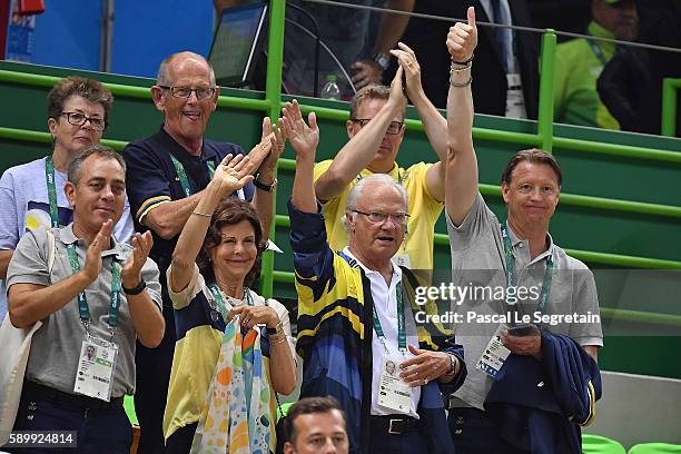 Queen Silvia of Sweden and King Carl Gustaf of Sweden and Swedish Olympic Committee President Hans Vestberg wave to the Team of Sweden after they win...