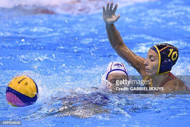 Russia's Elvina Karimova vies with Spain's Roser Tarrago Aymerich during their Rio 2016 Olympic Games water polo quarter-final game at the Olympic...