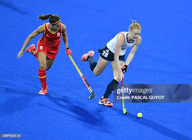 Spain's Rocio Ybarra vies with Britain's Nicola White during the women's quarterfinal field hockey Britain vs Spain match of the Rio 2016 Olympics...