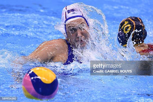 Russia's Nedezhda Glyzina vies with Spain's Roser Tarrago Aymerich during their Rio 2016 Olympic Games water polo quarter-final game at the Olympic...