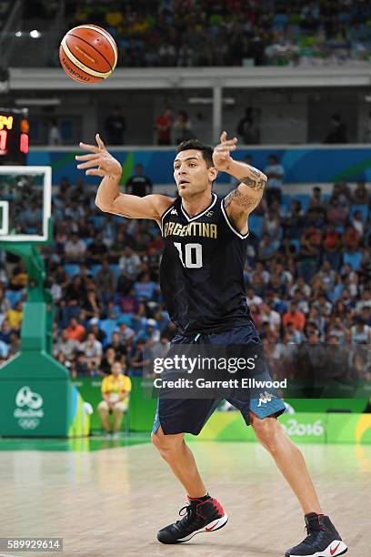 Carlos Delfino of Argentina passes the ball against Spain on Day 10 of the Rio 2016 Olympic Games at Carioca Arena 1 on August 15, 2016 in Rio de...