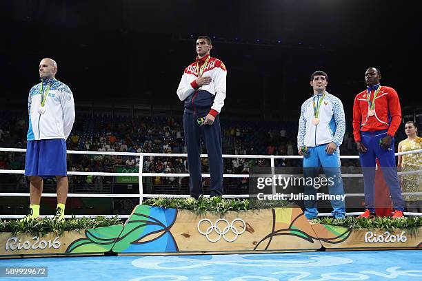 Evgeny Tishchenko of Russia with the gold, Vassiliy Levit of Kazakhstan with silver, Rustam Tulaganov of Uzbekistan with bronze and Erislandy Savon...