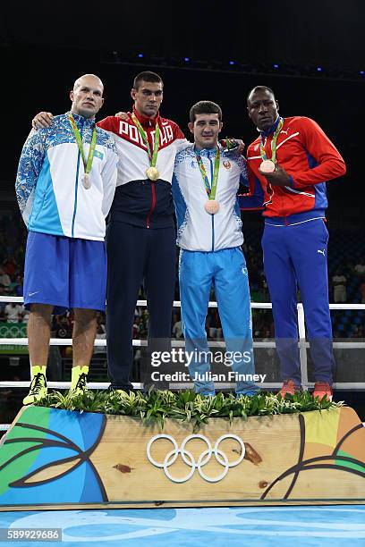 Evgeny Tishchenko of Russia with the gold, Vassiliy Levit of Kazakhstan with silver, Rustam Tulaganov of Uzbekistan with bronze and Erislandy Savon...