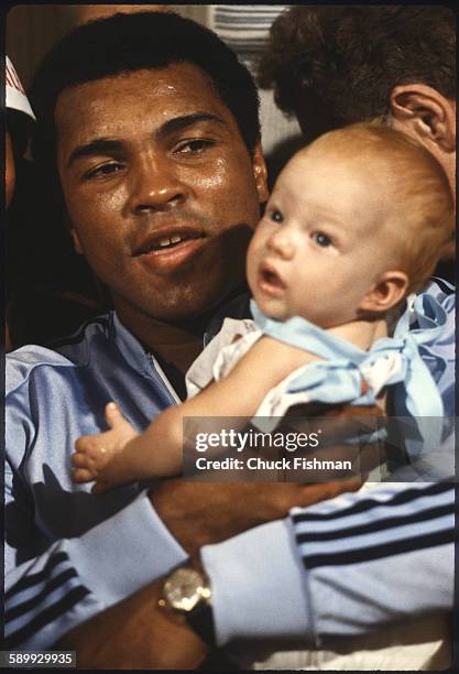After his victory in a championship bout , American heavyweight boxer Muhammad Ali holds his infant daughter Laila, New Orleans, Louisiana, September...