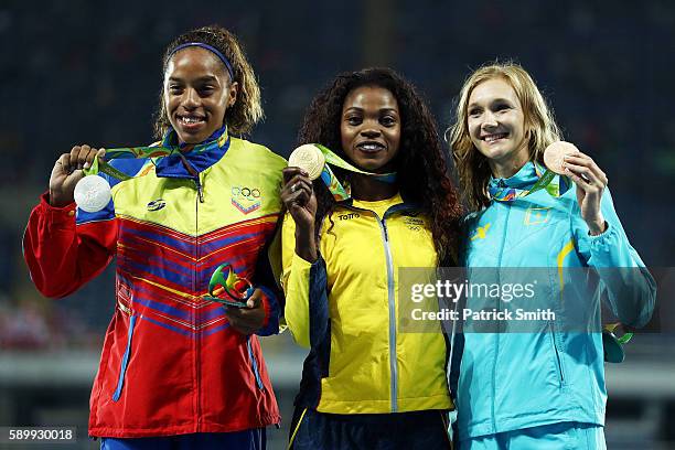 Silver medalist Yulimar Rojas of Venezuela, gold medalist Caterine Ibarguen of Colombia and bronze medalist Olga Rypakova of Kazakhstan pose on the...