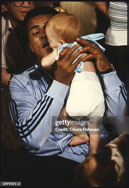 After his victory in a championship bout , American heavyweight boxer Muhammad Ali holds his infant daughter Laila, New Orleans, Louisiana, September...