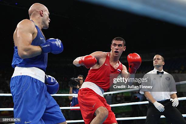 Evgeny Tishchenko of Russia fights Vassiliy Levit of Kazakhstan for the gold medal in the mens heavyweight 91kg during the Boxing at Riocentro on...