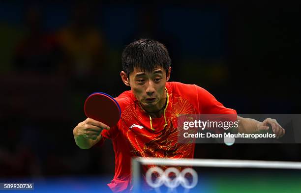 Jike Zhang of China in action against Youngsik Jeoung of Korea during the Men's Team Semifinal Badminton on Day 10 of the Rio 2016 Olympic Games at...