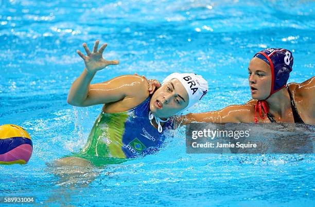 Kiley Neushul of United States grabs Viviane Bahia of Brazil during the Women's Water Polo quarterfinal match against United States at the Rio 2016...