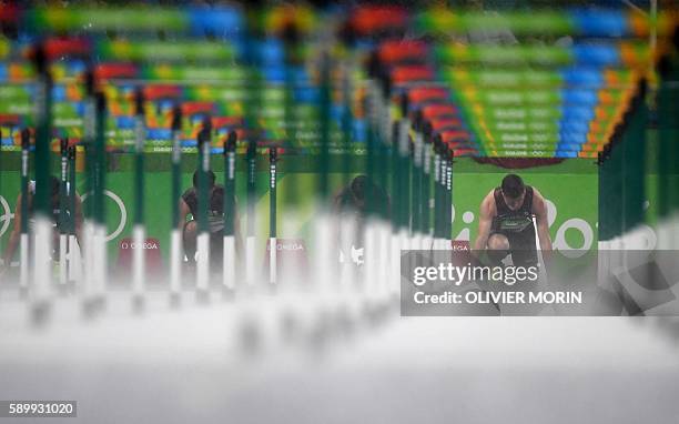 Athletes prepare to compete in the Men's 110m Hurdles Round 1 during the athletics event at the Rio 2016 Olympic Games at the Olympic Stadium in Rio...