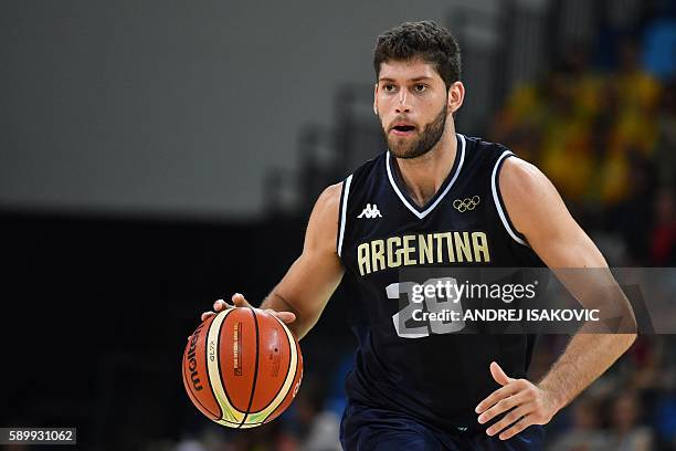 Argentina's shooting guard Patricio Garino runs during a Men's round Group B basketball match between Spain and Argentina at the Carioca Arena 1 in...