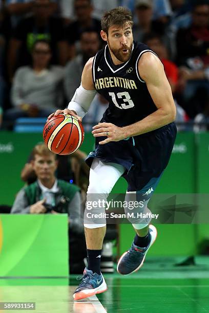 Andres Nocioni of Argentina moves the ball during a Men's Basketball Preliminary Round Group B game between Spain and Argentina on Day 10 of the Rio...