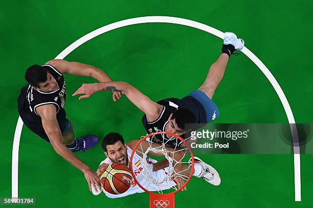 Felipe Reyes of Spain shoots against Gabriel Deck of Argentina during a Men's Basketball Preliminary Round Group B game between Spain and Argentina...