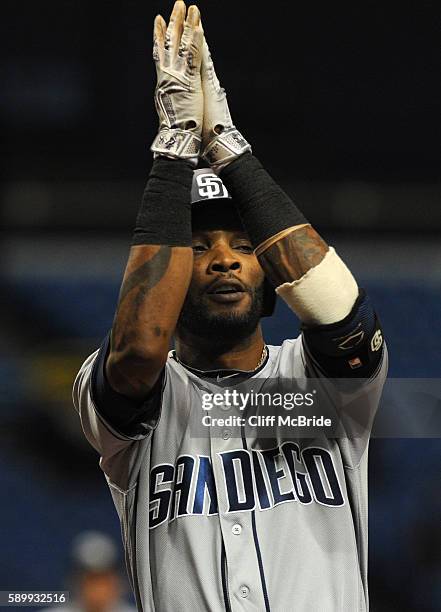 Alexei Ramirez of the San Diego Padres crosses home plate after hitting a home run in the firt inning off Drew Smyly of the Tampa Bay Rays on August...