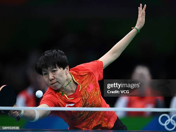 Li Xiaoxia of China competes against Feng Tianwei of Singapore during the Table Tennis Women's Team Round Semi Final between China and Singapore...
