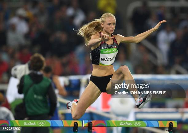 Canada's Sage Watson competes in the Women's 400m Hurdles Round 1 during the athletics event at the Rio 2016 Olympic Games at the Olympic Stadium in...