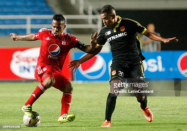 David Ferrerira of America de Cali fights for the ball with Oaldier Morales of Bogota during a match between America de Cali and Bogota FC as part of...