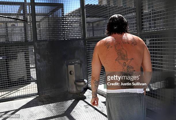 Condemned inmate stands in a cell in the yard outside of San Quentin State Prison's death row adjustment center on August 15, 2016 in San Quentin,...