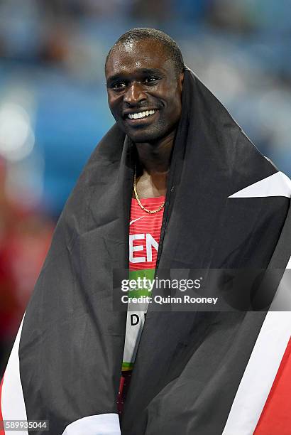 David Lekuta Rudisha of Kenya celebrates with the flag of Kenya after winning the gold medal in the Men's 800m Final on Day 10 of the Rio 2016...