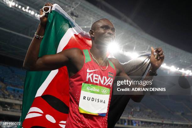 Kenya's David Lekuta Rudisha celebrates after winning the Men's 800m Final during the athletics competition at the Rio 2016 Olympic Games at the...