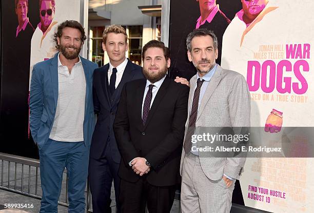 Producer/actor Bradley Cooper, actors Miles Teller, Jonah Hill and director/writer/producer Todd Phillips attend the premiere of Warner Bros....