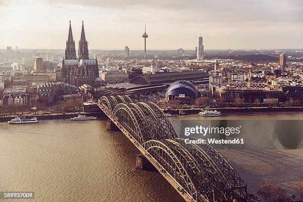 germany, cologne, view to skyline with rhine river and hohenzollern bridge in the foreground - germany skyline stock pictures, royalty-free photos & images