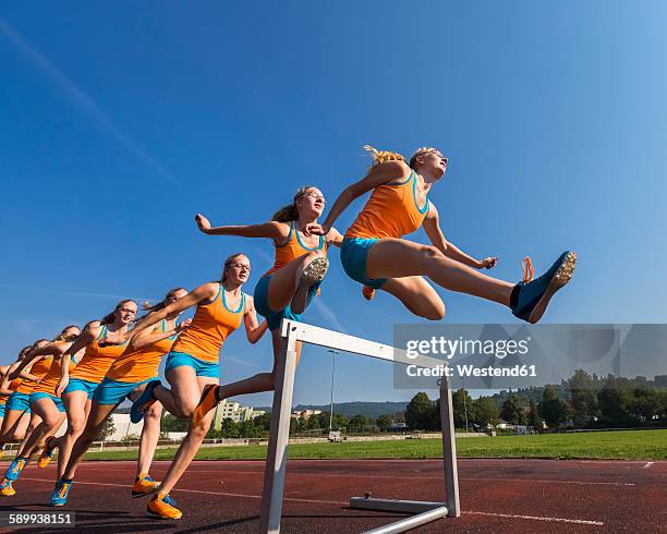 multiple image of female hurdler jumping over hurdle - meervoudig beeld stockfoto's en -beelden