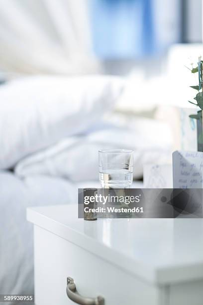 medicine on hospital bedside table - bedside table stock pictures, royalty-free photos & images