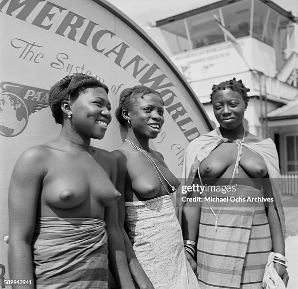 Group of Maroon People pose on the Pan American World Airways stairs, before taking a trip at the Paramaribo-Zanderij International Airport in...