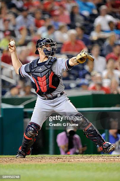 Anthony Recker of the Atlanta Braves throws the ball to second base against the Washington Nationals at Nationals Park on August 12, 2016 in...