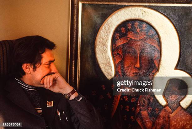 Polish trade-unionist Lech Walesa looks at a painting of the Black Madonna of Czestochowa, a Polish icon of protection, on the wall of his office at...