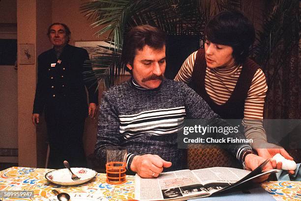 With his wife, Danuta , at his side, Polish trade-unionist Lech Walesa reads a magazine during breakfast in the couple's home, Gdansk, Poland,...