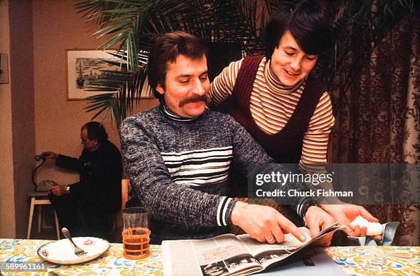 With his wife, Danuta , at his side, Polish trade-unionist Lech Walesa reads a magazine during breakfast in the couple's home, Gdansk, Poland,...